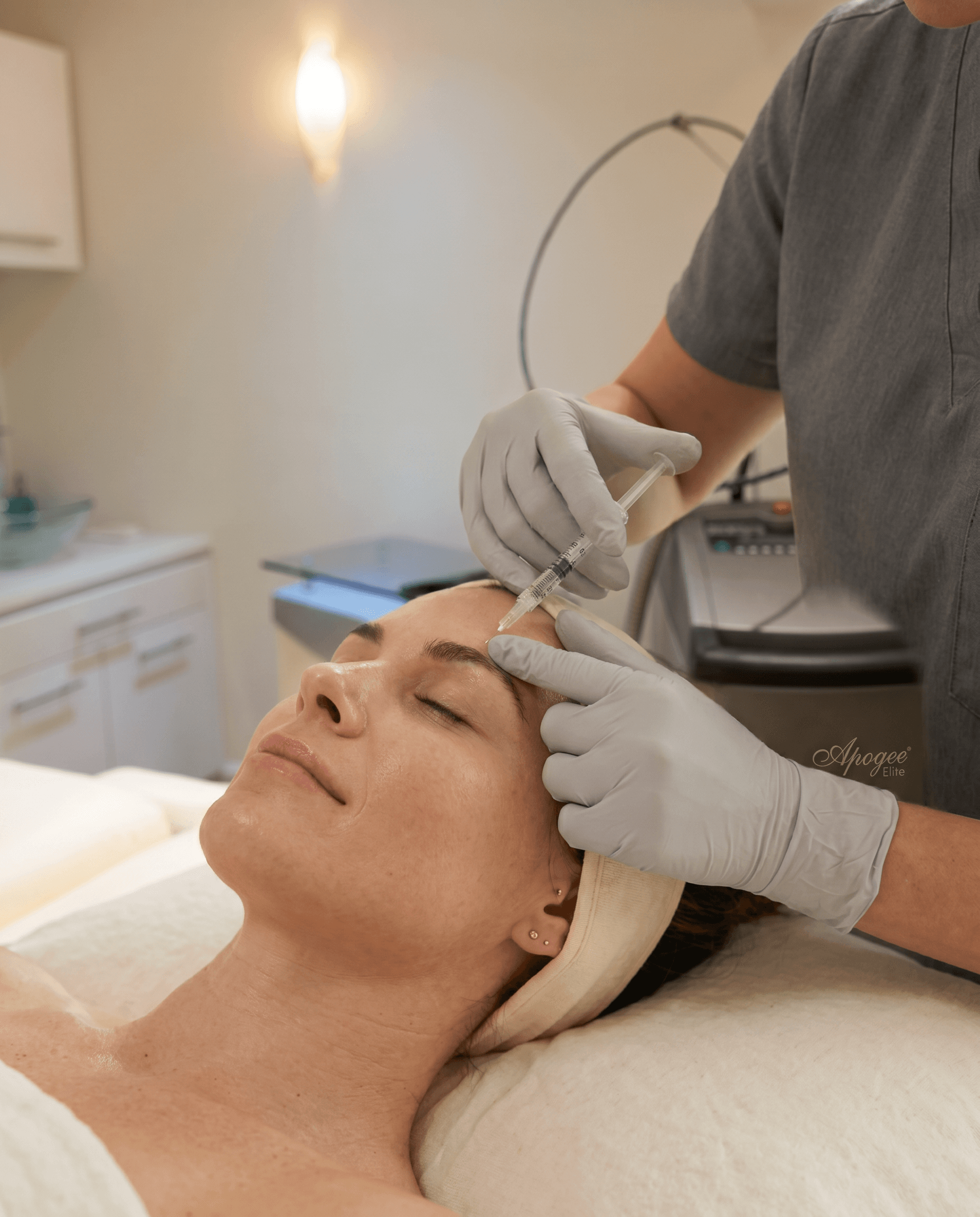 Injectable treatment in a bright, clinical medspa suite